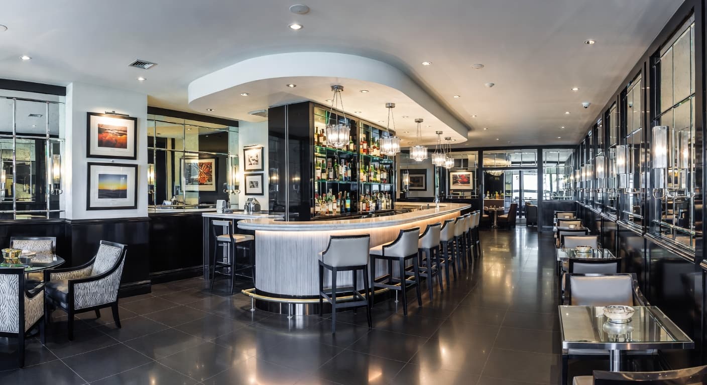 Streamline Moderne bar room interior design - featuring streamline moderne style furniture, decor, colors, and layout ideas for your bar room